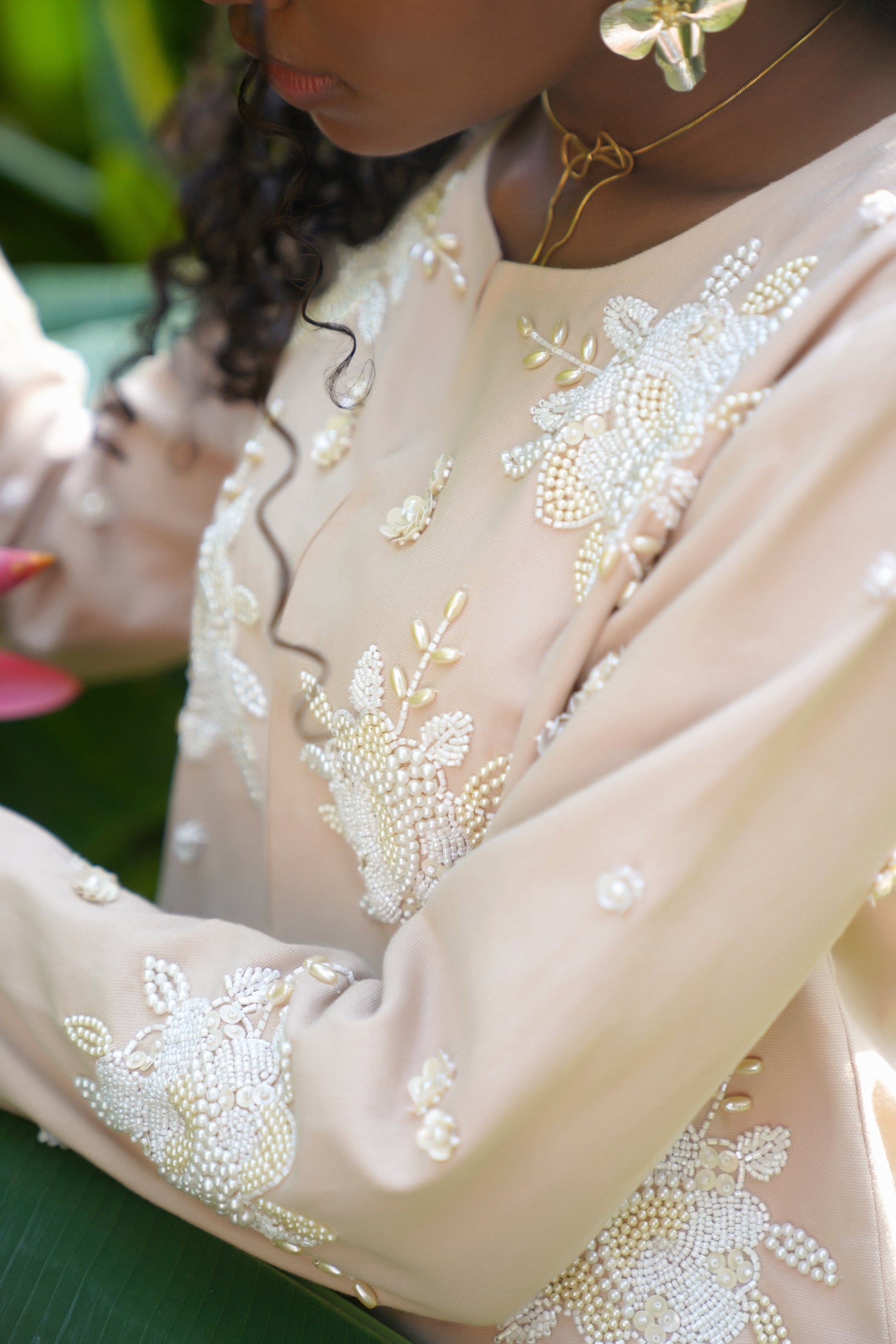 Side detail picture of off-white embroidered jacket