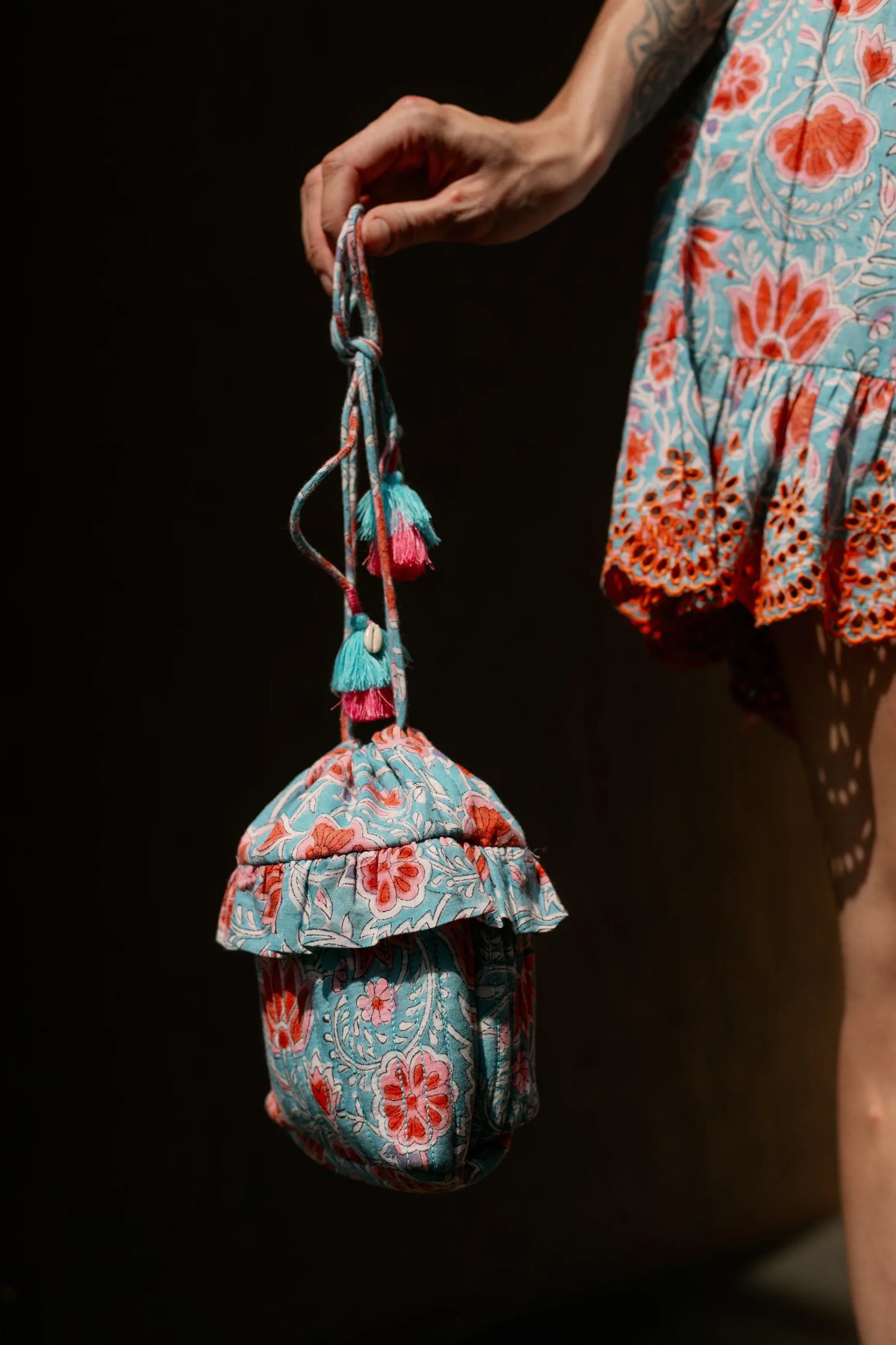 Side picture of aqua bucket bag