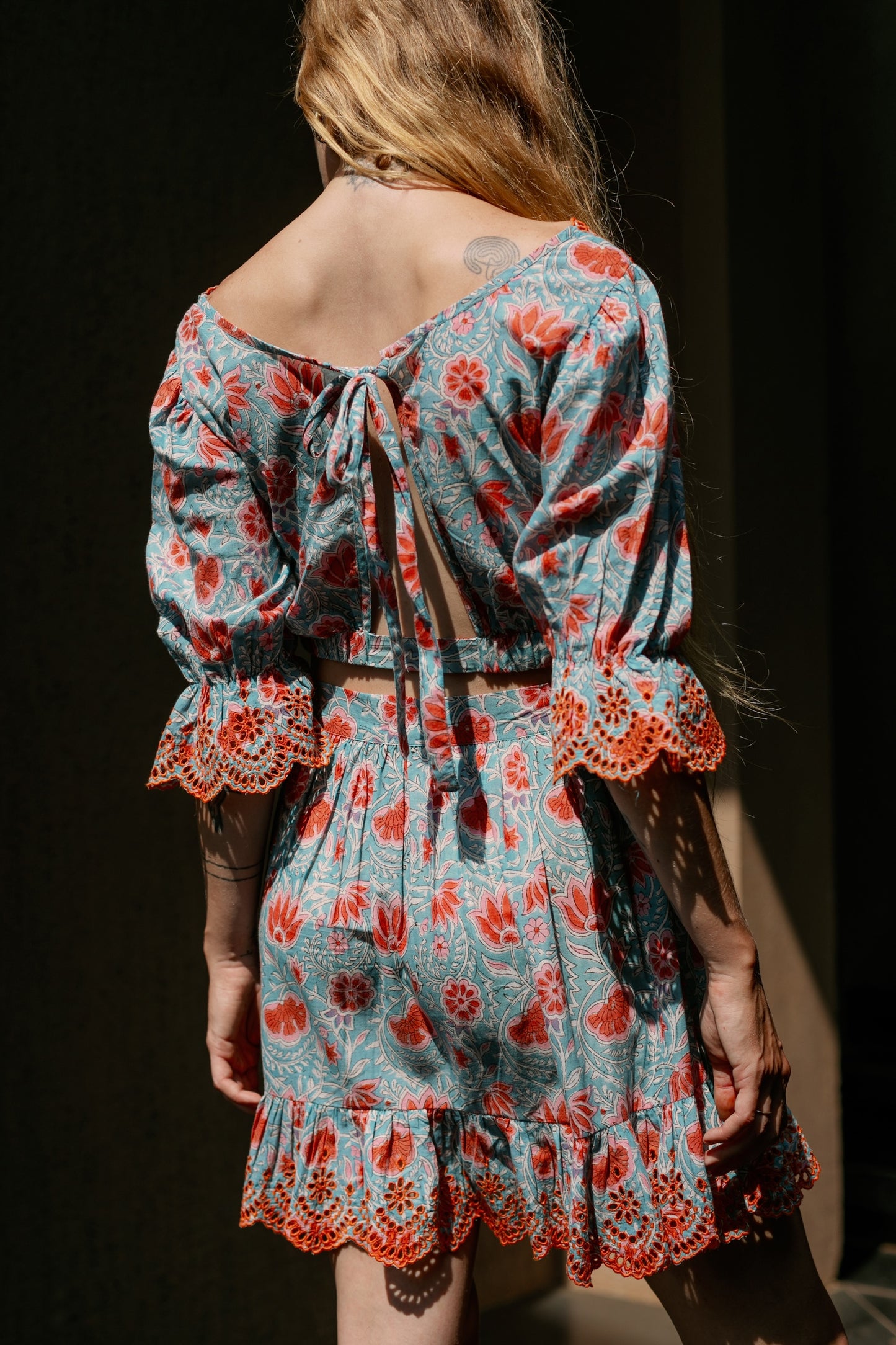 Back picture of backless crop top and skirt set