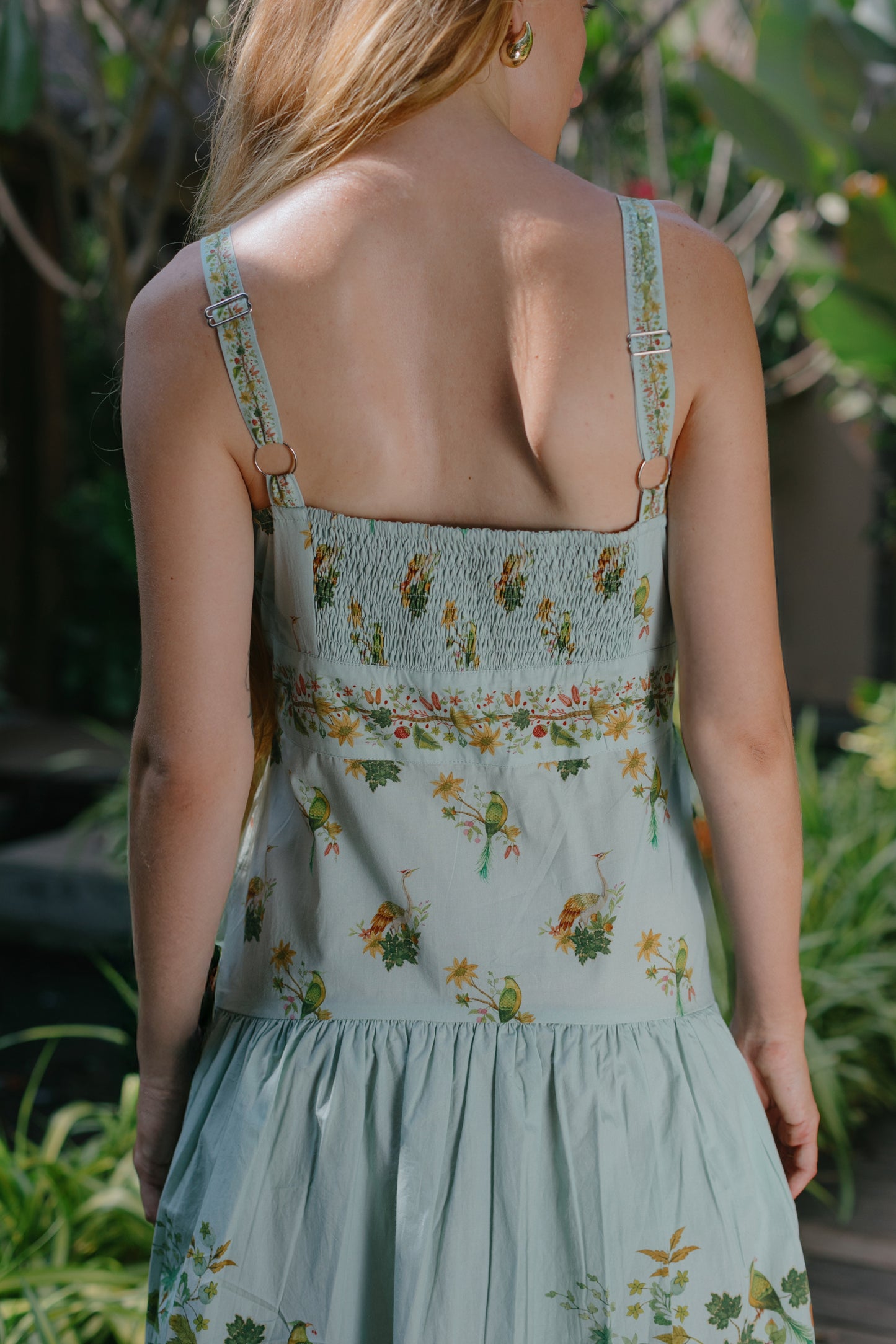 Back close up picture of blue floral drop waist dress