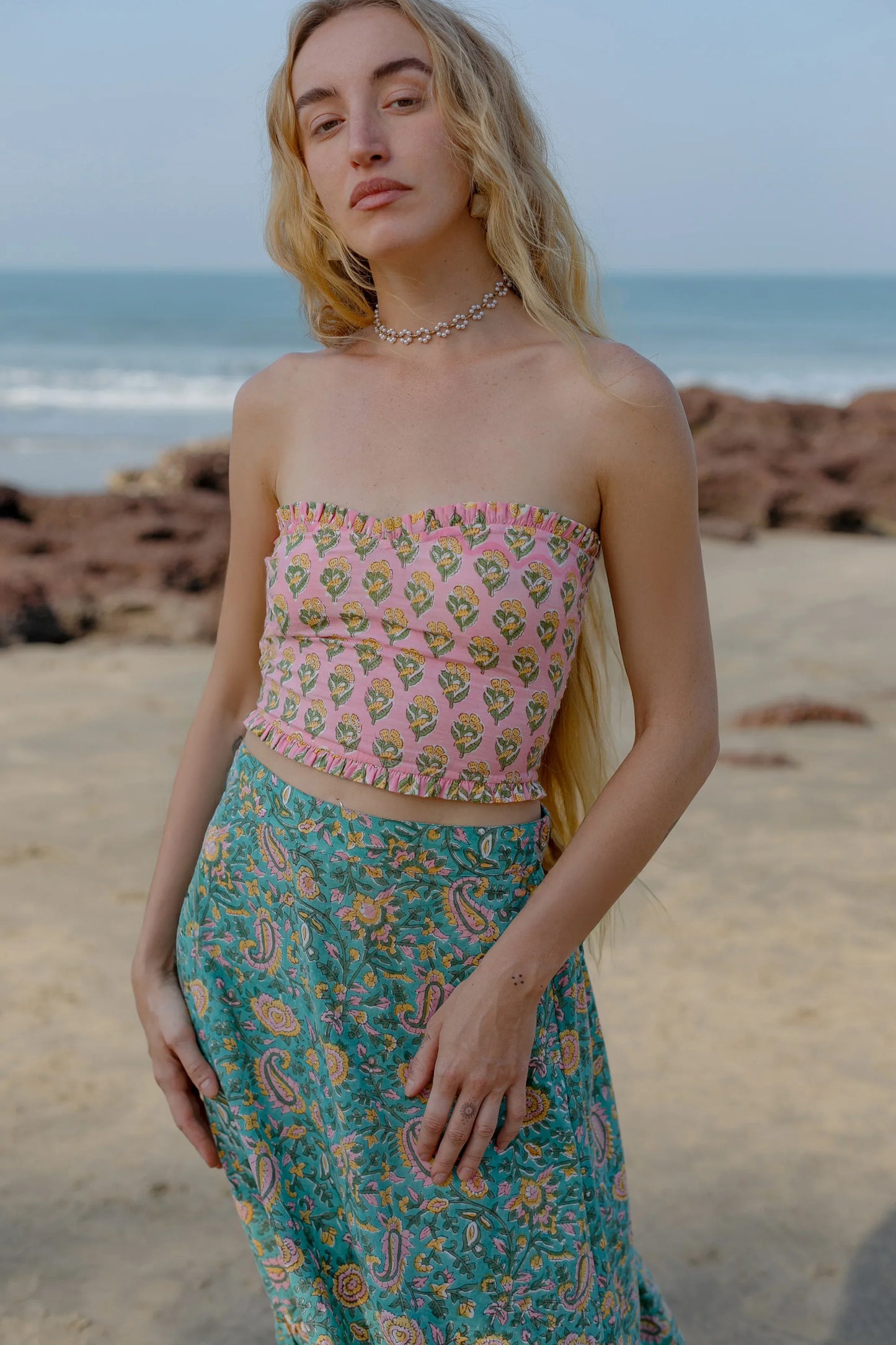 Close-up picture of pink 2 piece crop top and skirt set