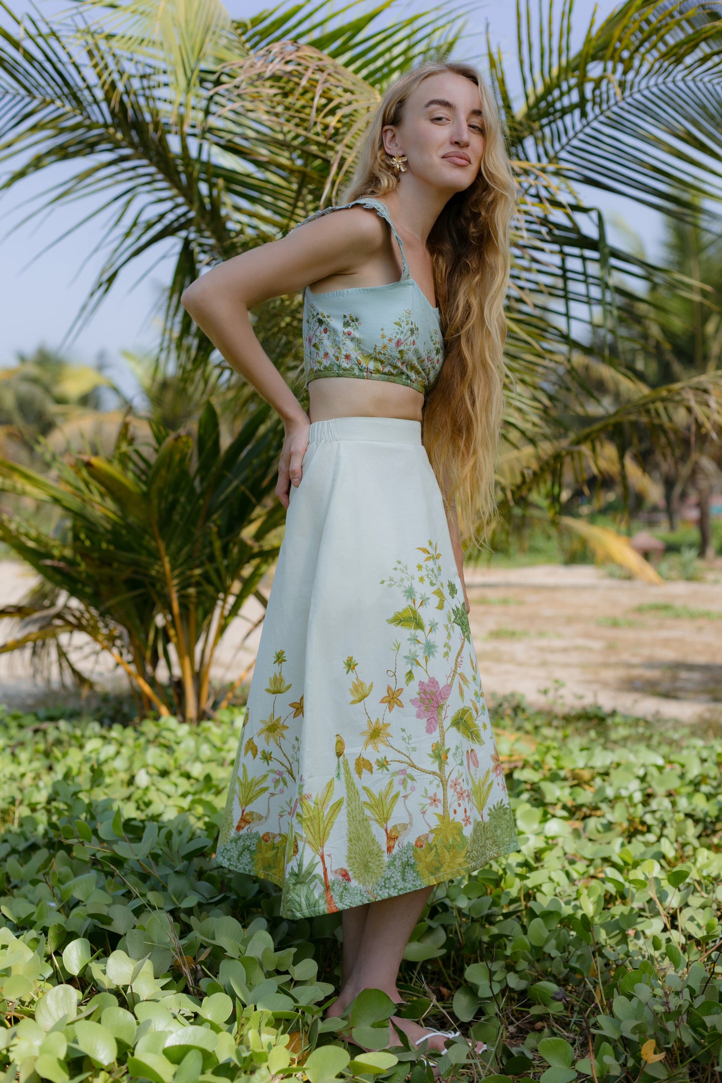 Side picture of strappy crop top and midi skirt