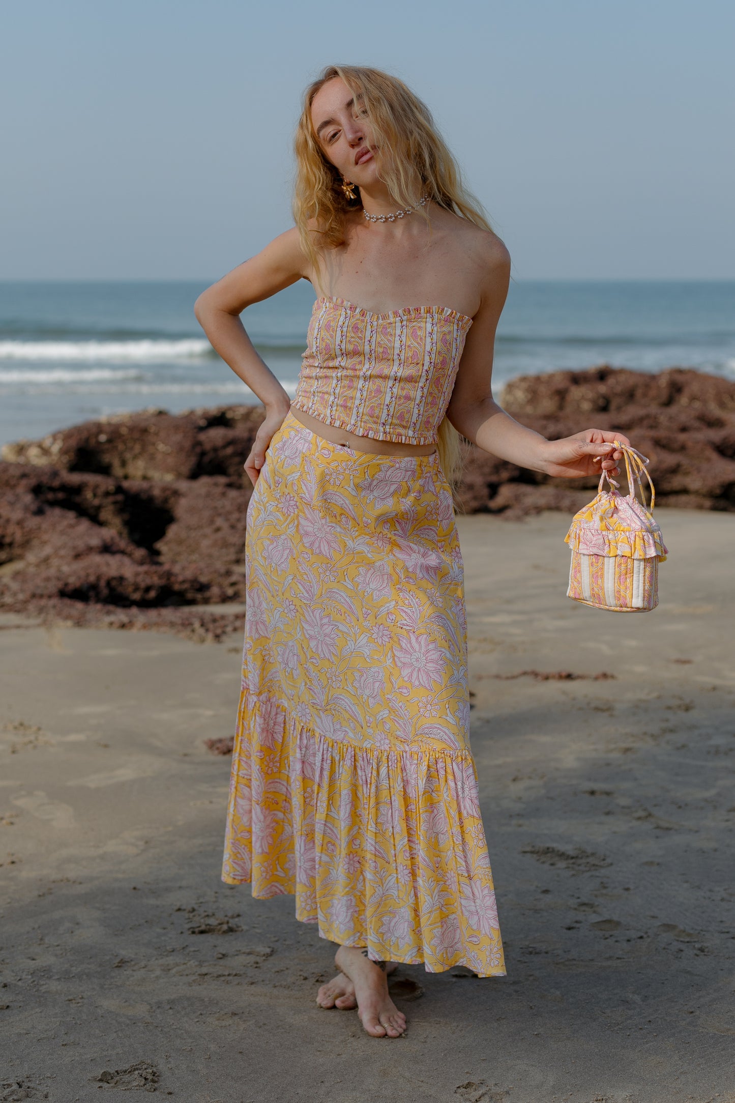 Front picture of model wearing yellow bucket bag