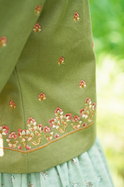 Detail picture of the embroidery on sage green embroidered jacket
