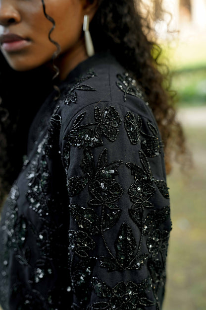 Detail picture of the sleeve on Black hand-embroidered bomber jacket