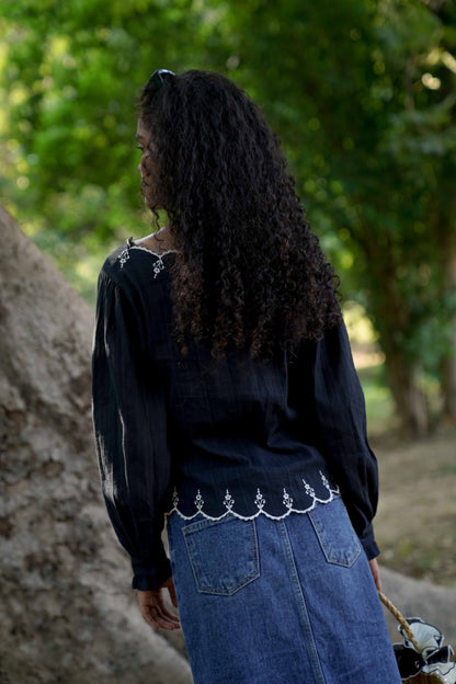 Back picture of black embroidered top with full sleeves