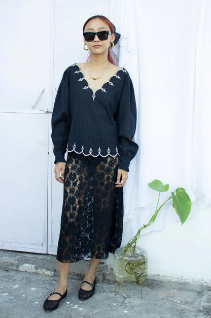 Front picture of black embroidered top with full sleeves