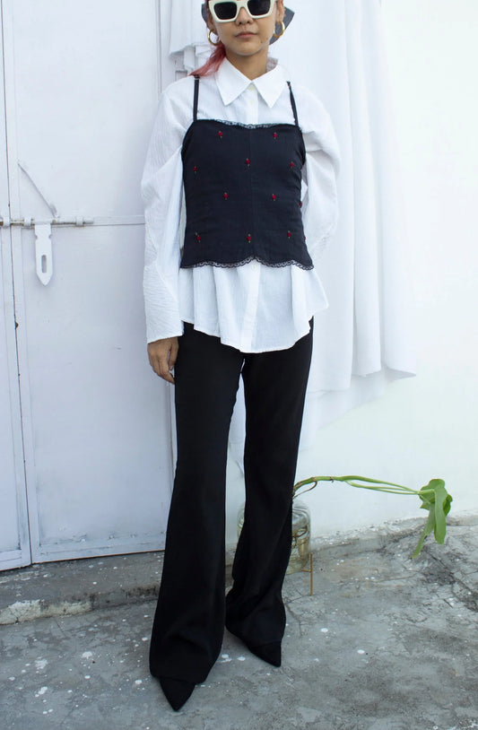 Full front picture of black embroidered camisole with black bottom styling option