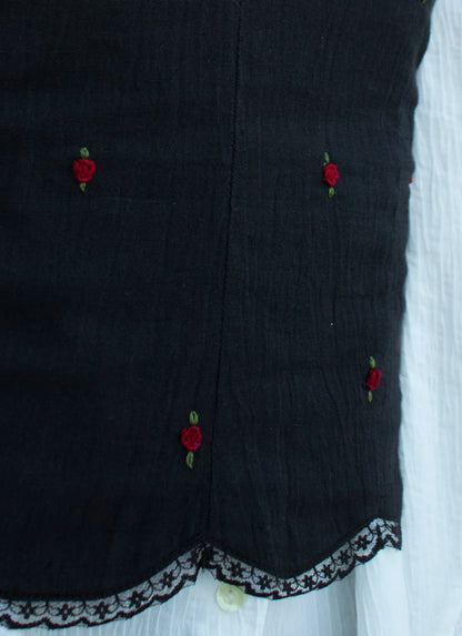 Detail picture black embroidered camisole showing red rose embroidery and scallop hem with lace detail 02