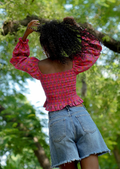 Back picture of pink floral long sleeve crop top in 100% cotton