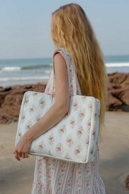 Side image of pink Buta tote bag with model