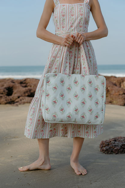 Front image of pink Buta tote bag with model
