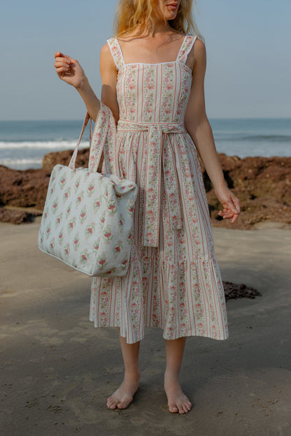 Front image of pink Buta tote bag with model