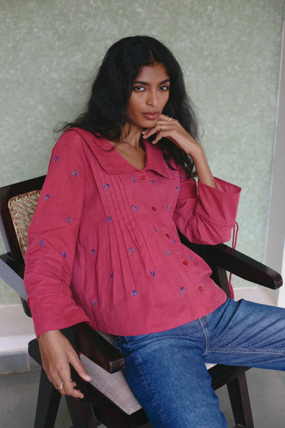 Close-up of Red embroidered cotton linen boho blouse with oversized collar and tassel on sleeves — Amaya World