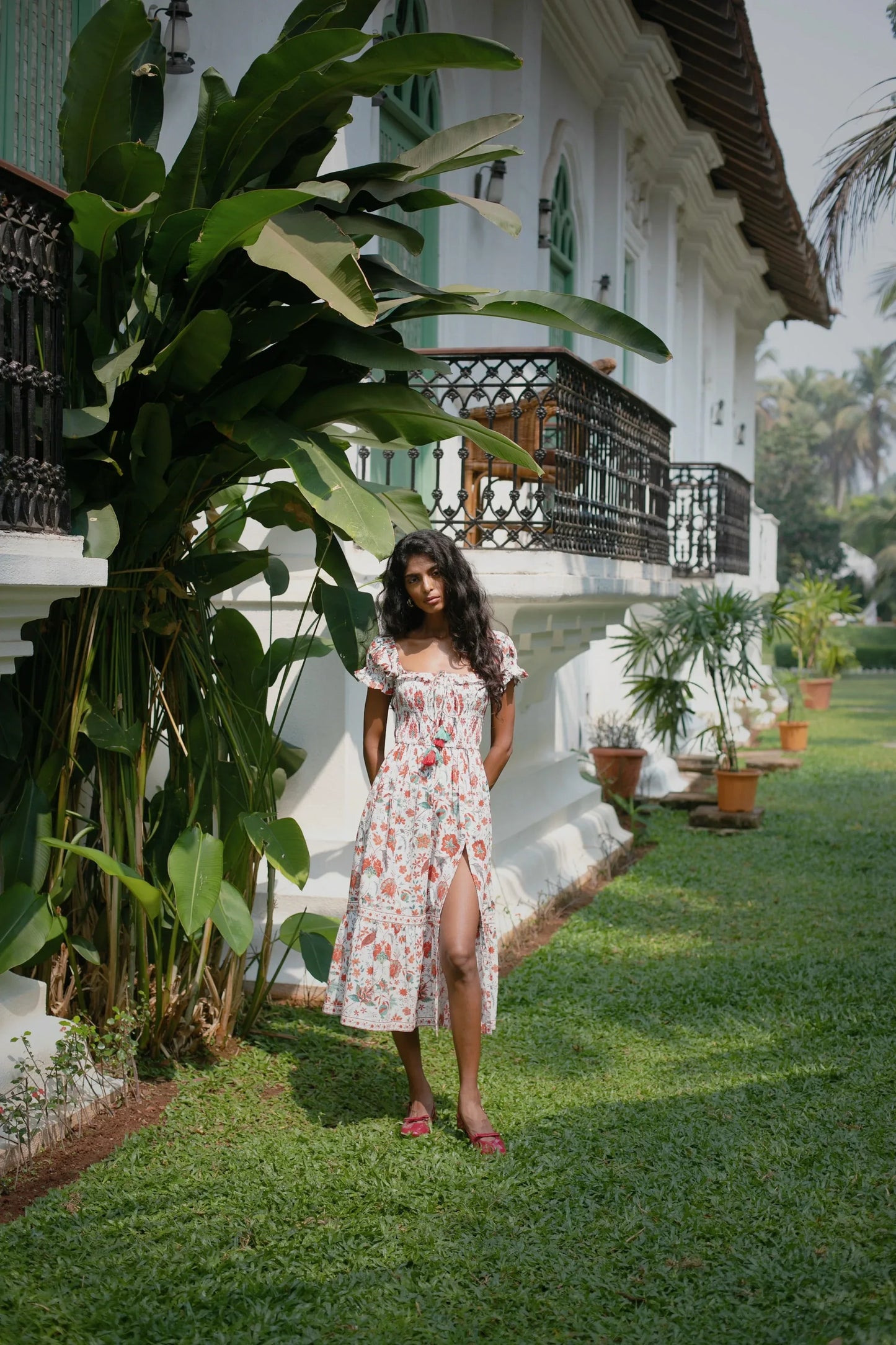 White and red floral fit-and-flare cotton midi dress with smocked bodice, short puff sleeves and tasles styled— Amaya World