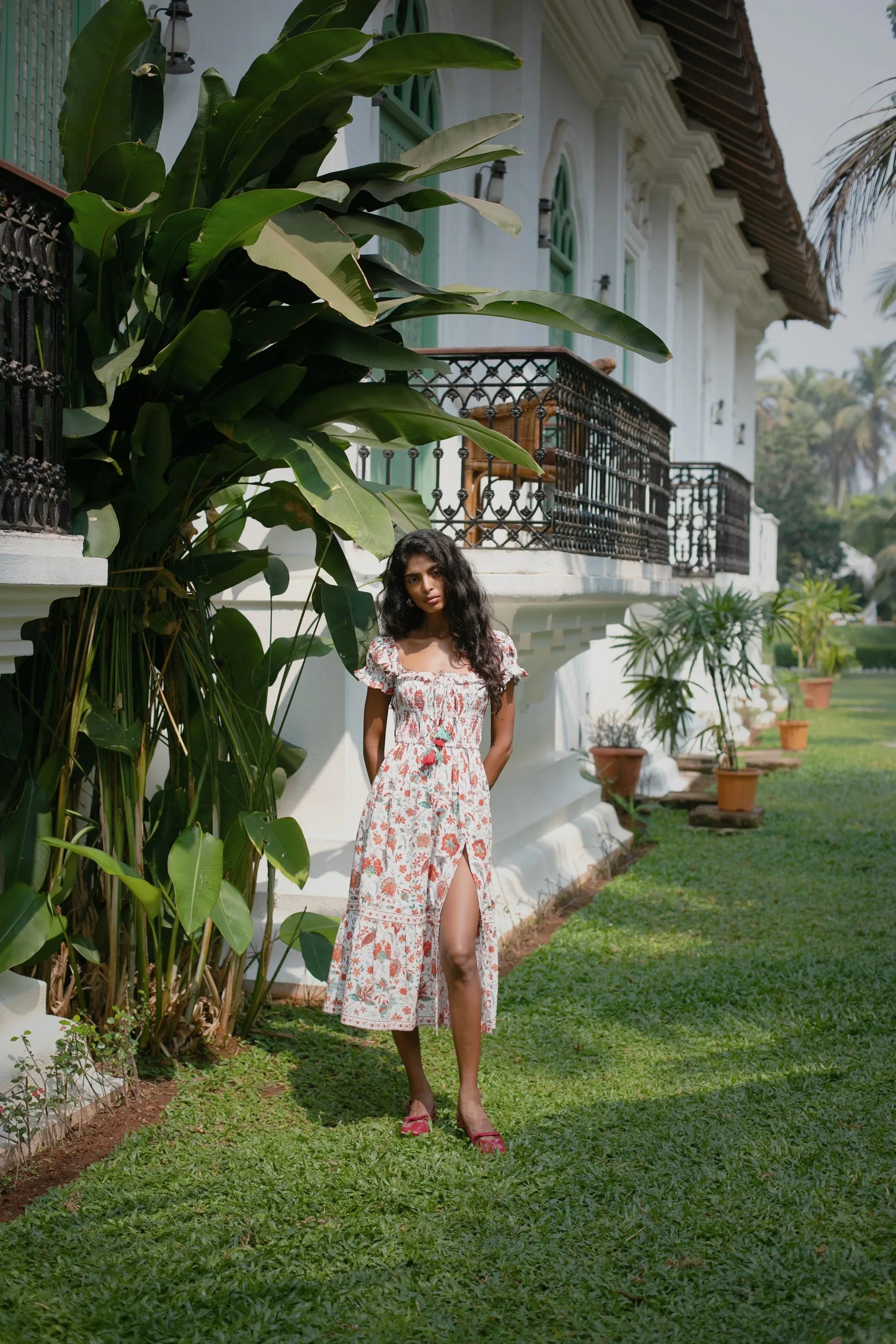 White and red floral fit-and-flare cotton midi dress with smocked bodice, short puff sleeves and tasles styled— Amaya World