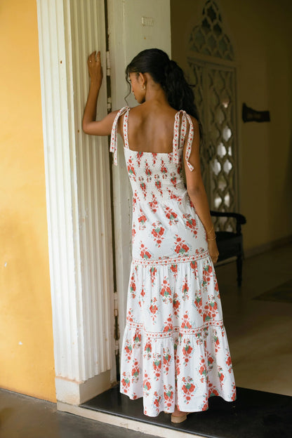Back view of white Chintz tiered maxi sundress showing tie-up straps and elasticated back — Amaya World