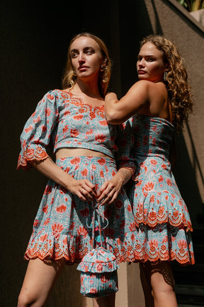 Front picture of models wearing aqua bucket bag