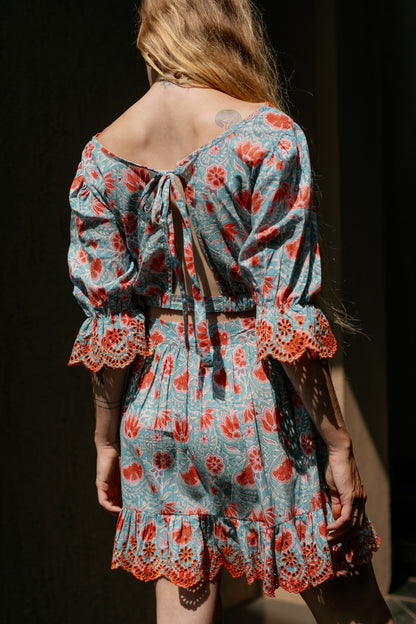 Back picture of backless crop top and skirt set 