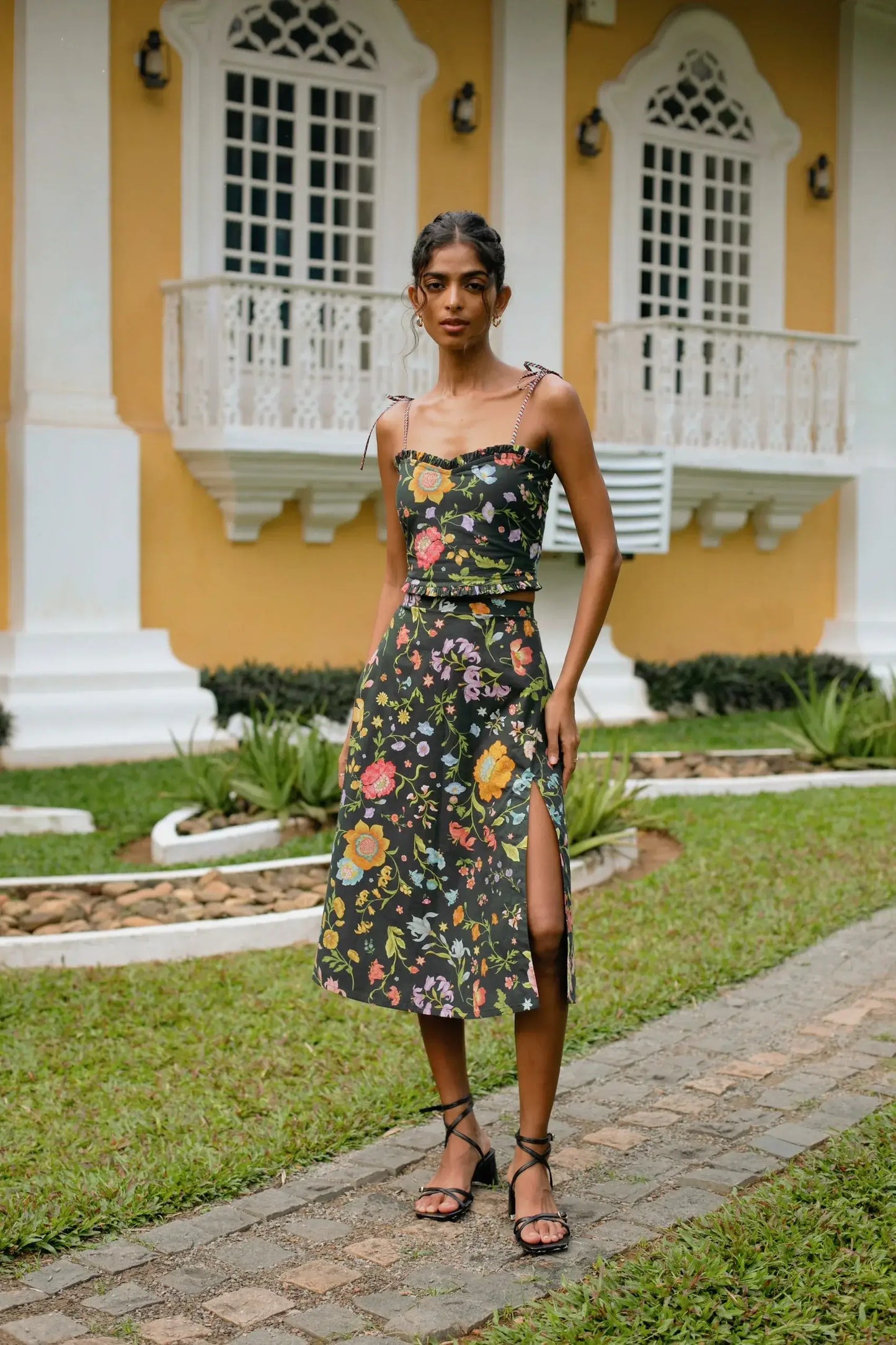 Black Mughal-inspired floral print high-waist cotton poplin pencil skirt with high slit paired with black floral cropped top with sweetheart neckline and tie-up straps— Amaya World