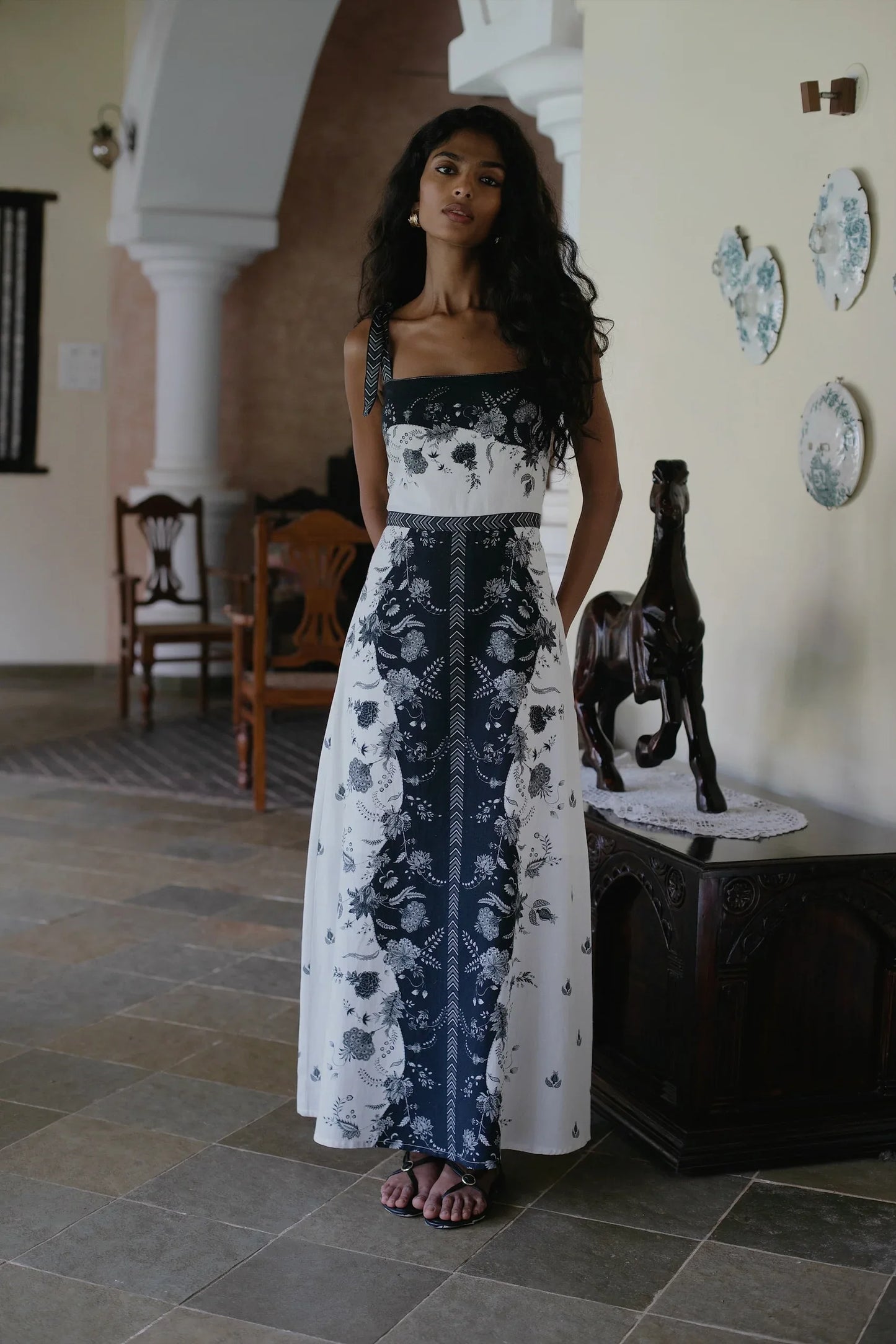 Full front view of Black white floral cotton linen maxi dress styled for a wedding or graduation or party — Amaya World