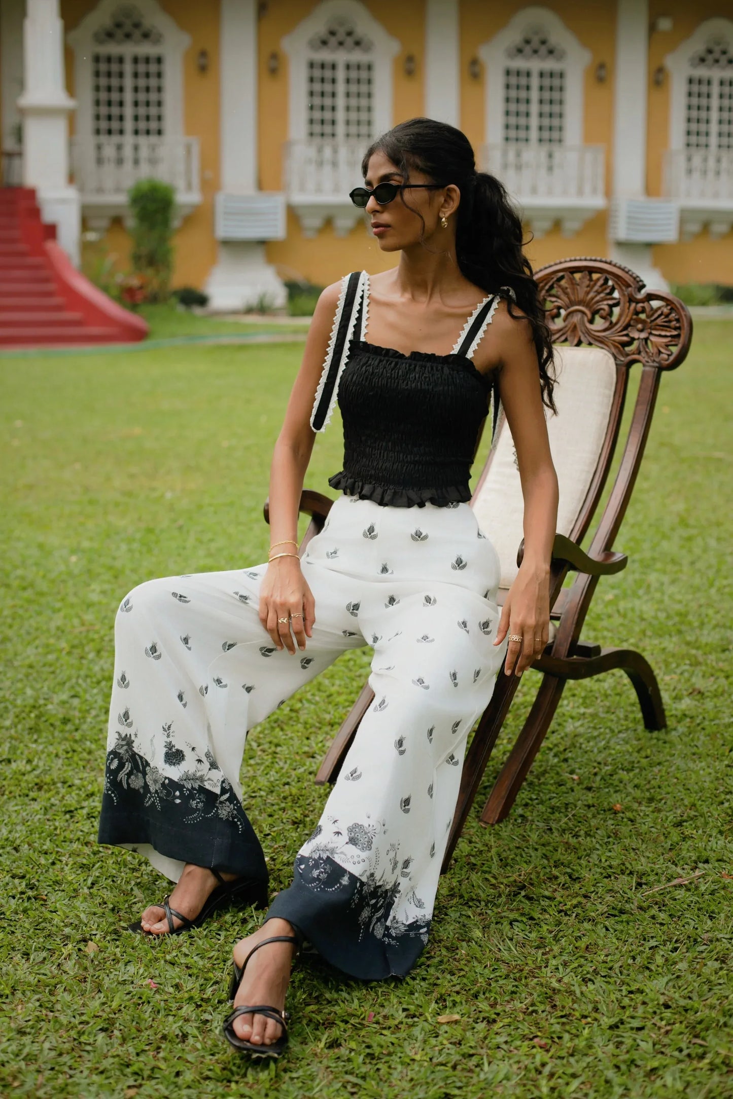 Black and white floral print high-waisted wide-leg cotton linen blend trousers styled with black crop top with smocking and lace detail - Amaya World