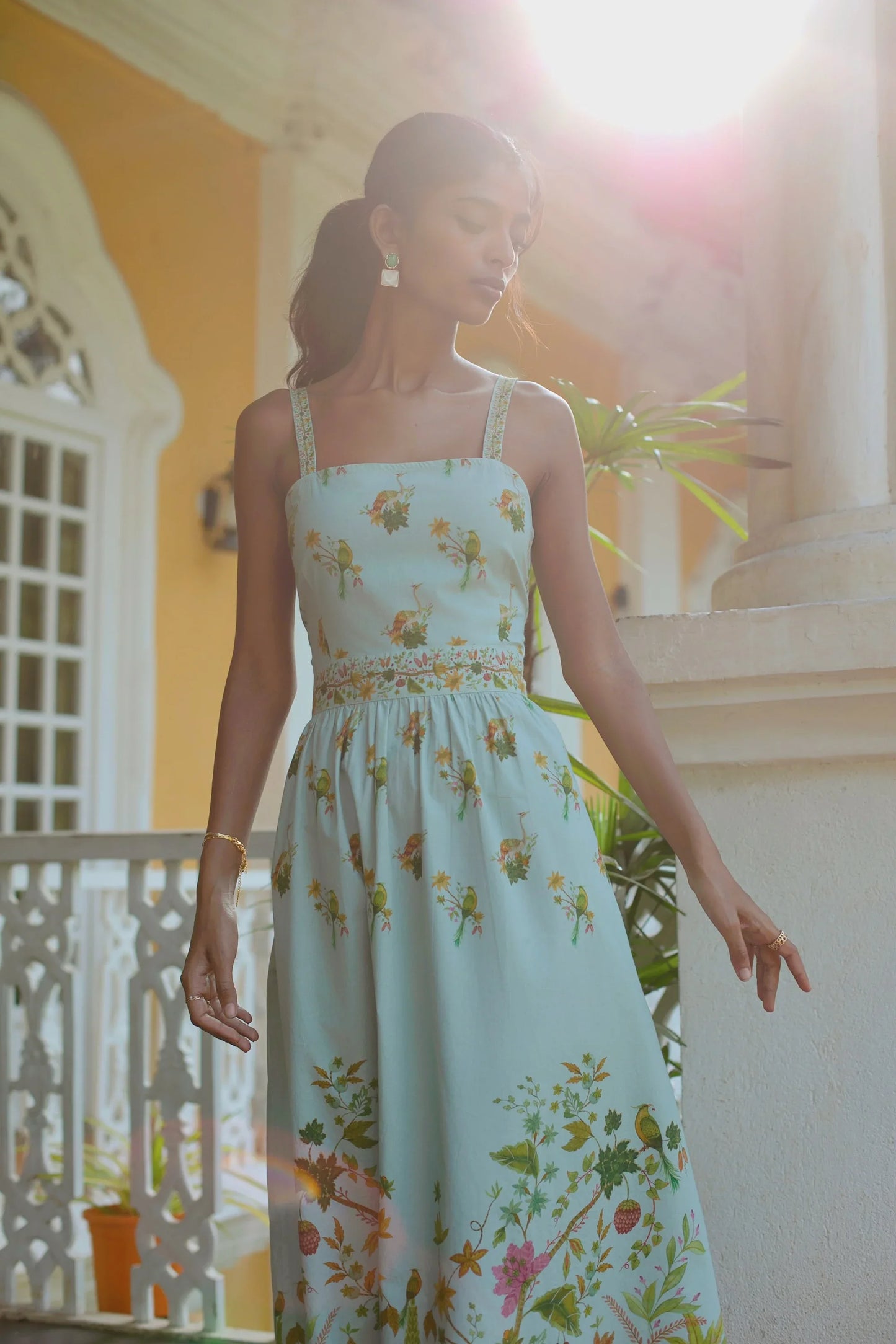 Close-up of floral botanical fit-and-flare midi sundress in blue made in 100% cotton— Amaya World