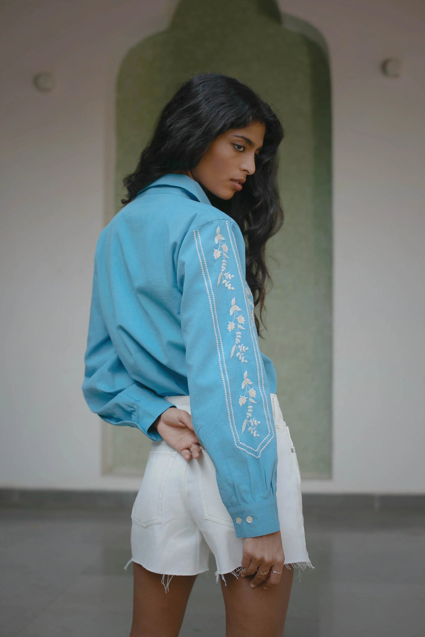 Back view of blue embroidered cotton button-down shirt showing relaxed fit — Amaya World