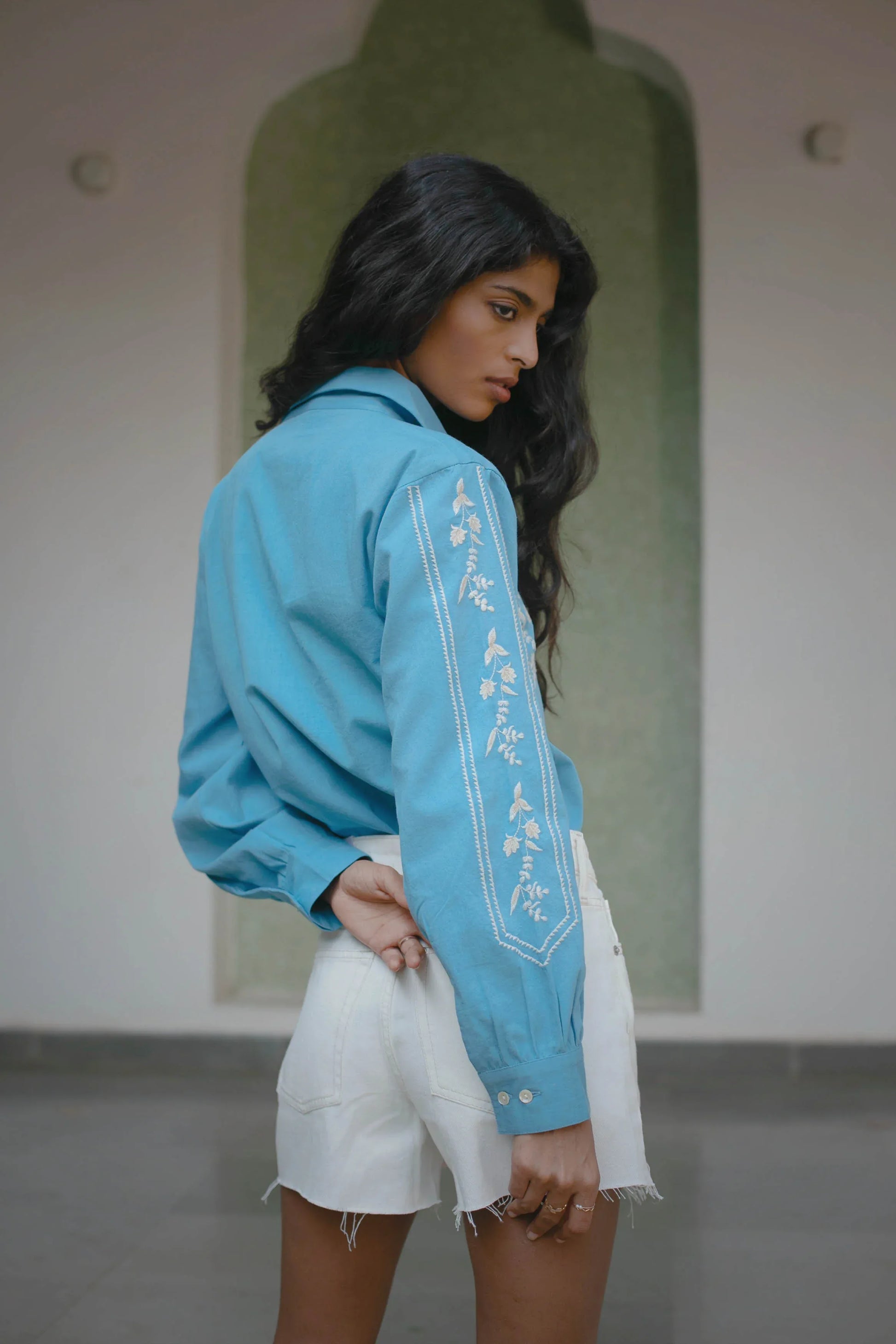 Back view of blue embroidered cotton button-down shirt showing relaxed fit — Amaya World