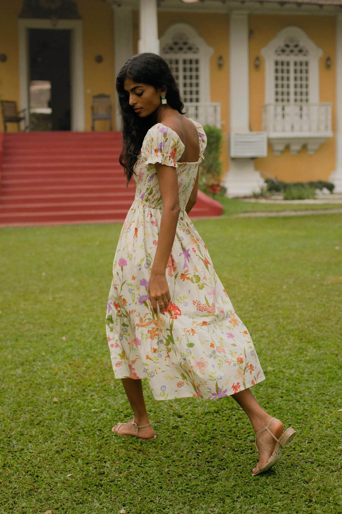 Back view of cream floral midi dress showing smocked bodice, puff sleeves and elasticated fit — Amaya World
