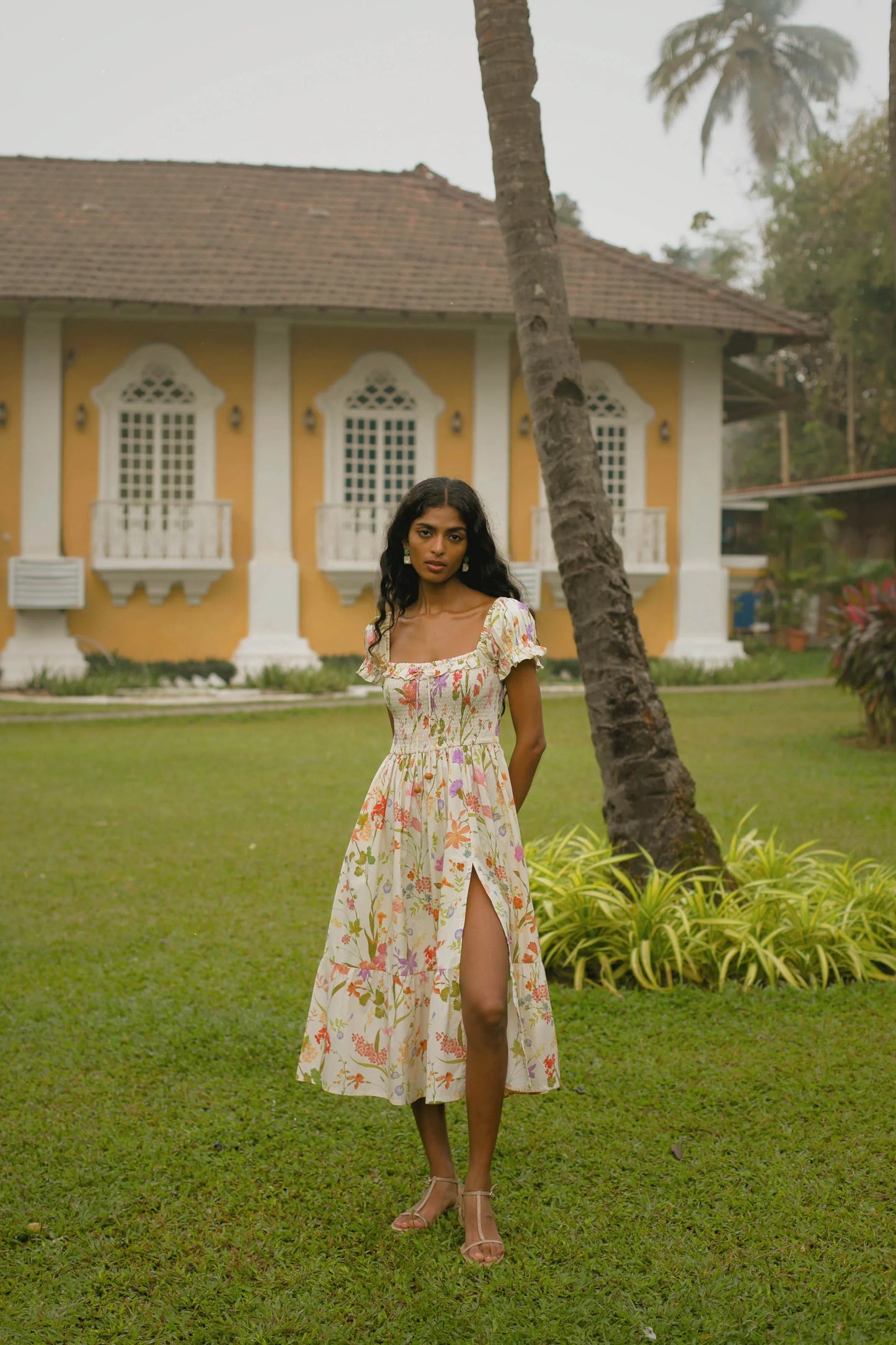 Cream floral cotton midi dress with puff sleeves styled for summer wedding or vacation — Amaya World slow fashion