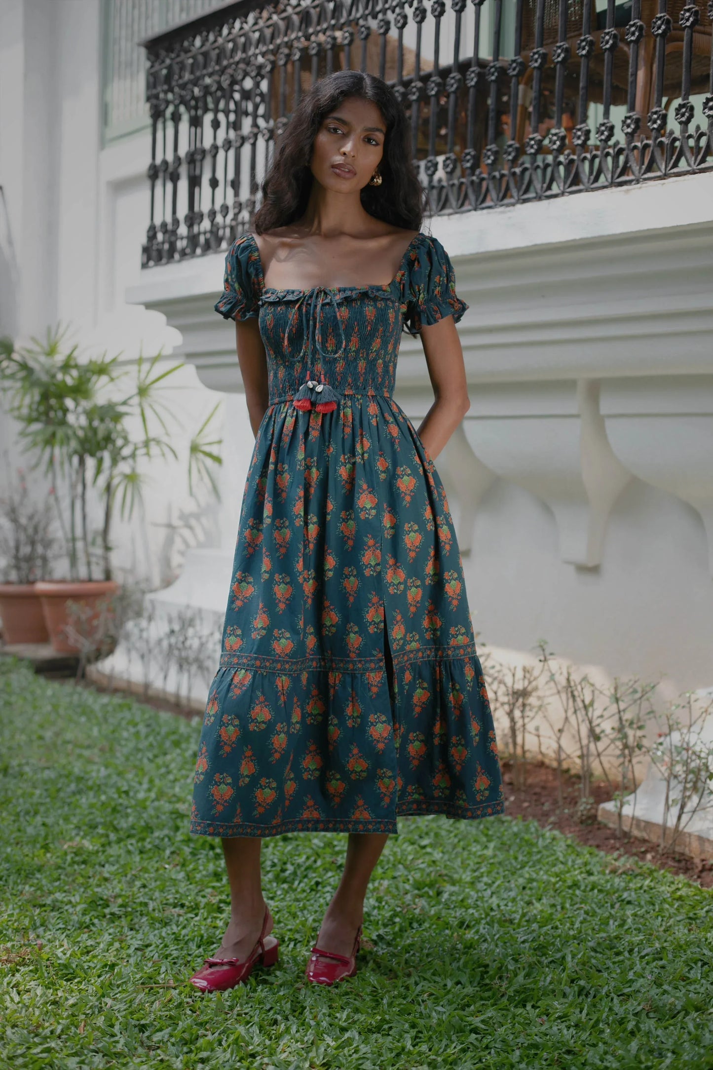 Navy Chintz floral cotton midi dress with puff sleeves styled for a wedding, holiday or occasion — Amaya World slow fashion