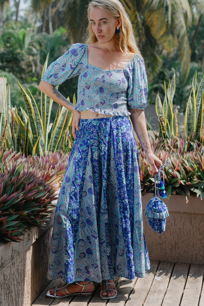 Front picture of model wearing indigo bucket bag