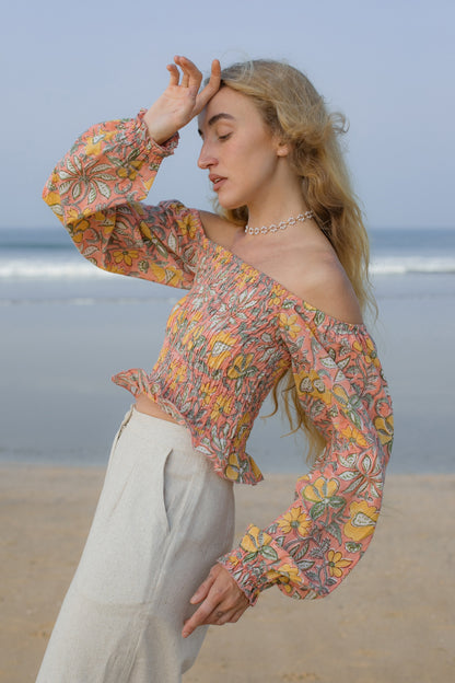 Side image of orange floral crop top