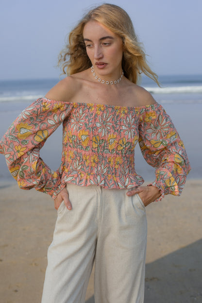 Front image of orange floral crop top
