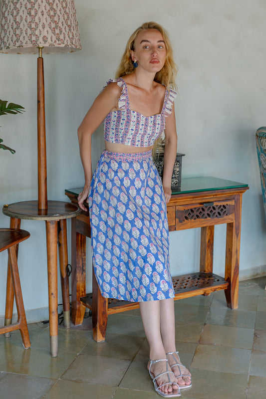 Front image of purple crop top and skirt set