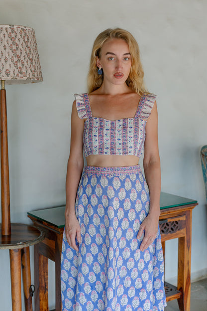 Front close up image of purple crop top and skirt set