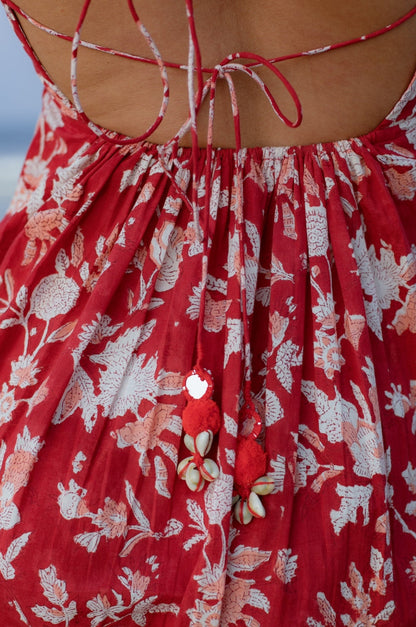 Image of tassles on red mini dress