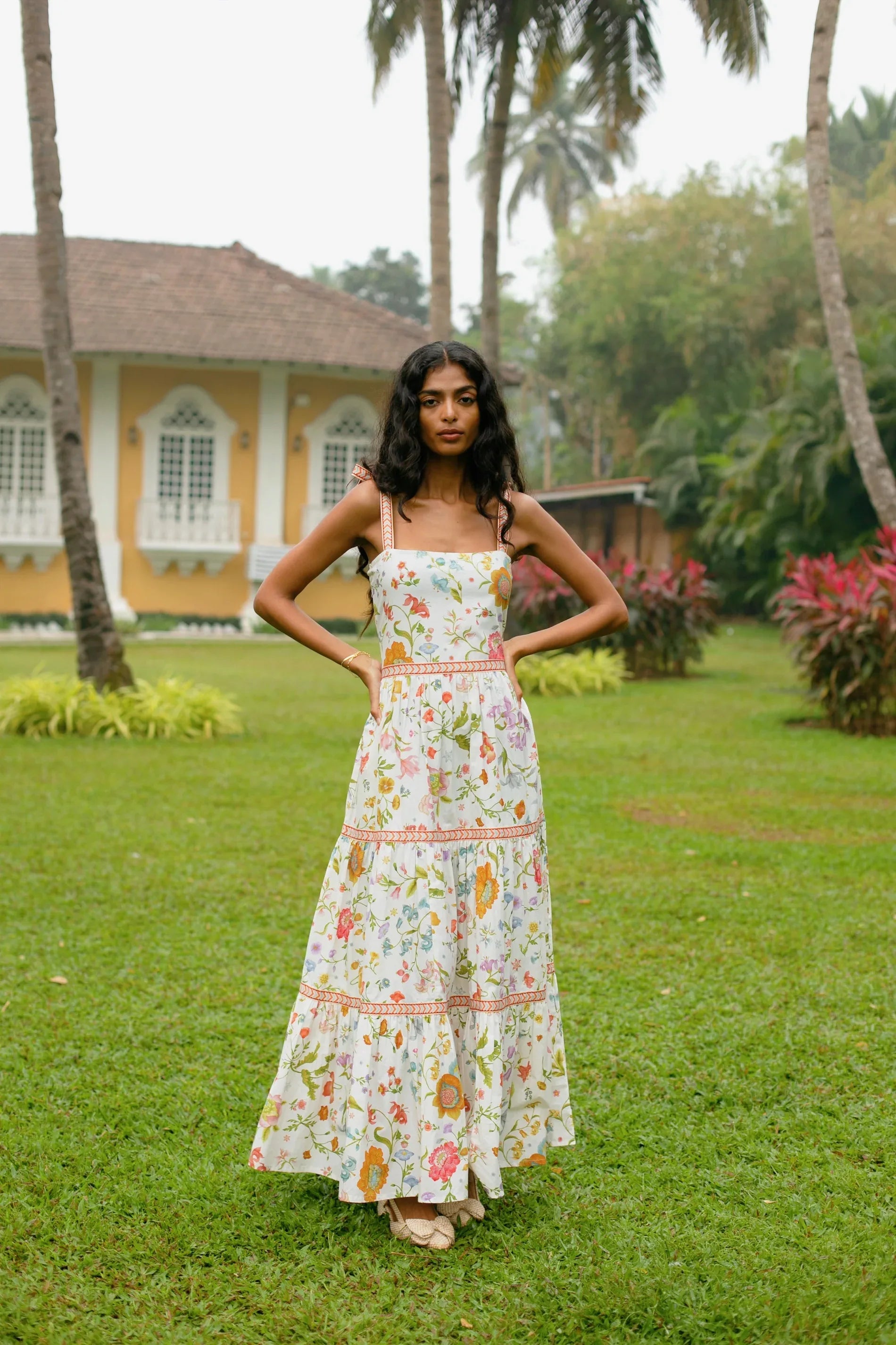 Front view of white floral tiered cotton maxi sundress with tie-up straps and Fit and flare silhouette — Amaya World