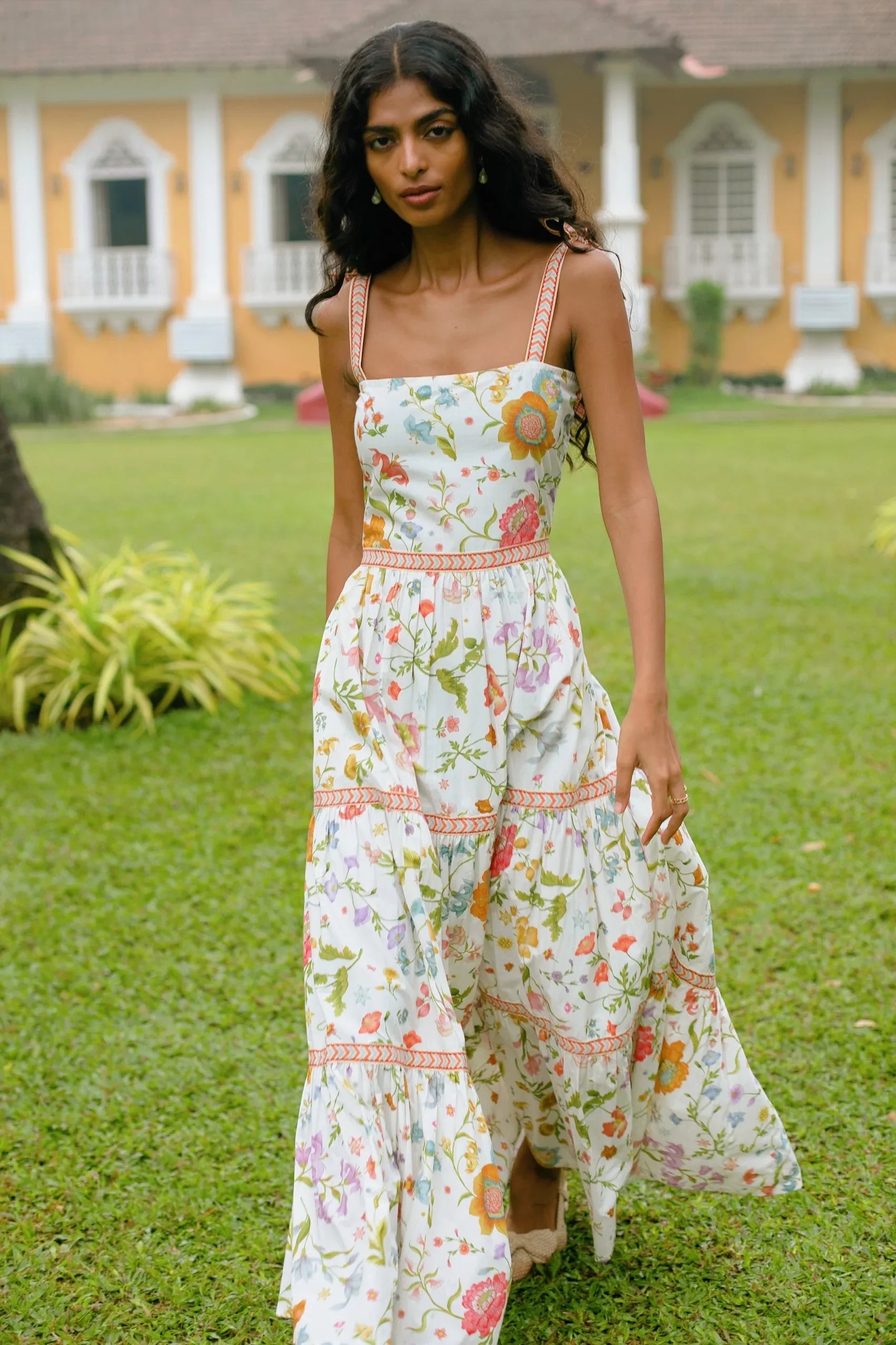 Close-up view of white floral tiered cotton maxi sundress with tie-up straps and A-line silhouette — Amaya World