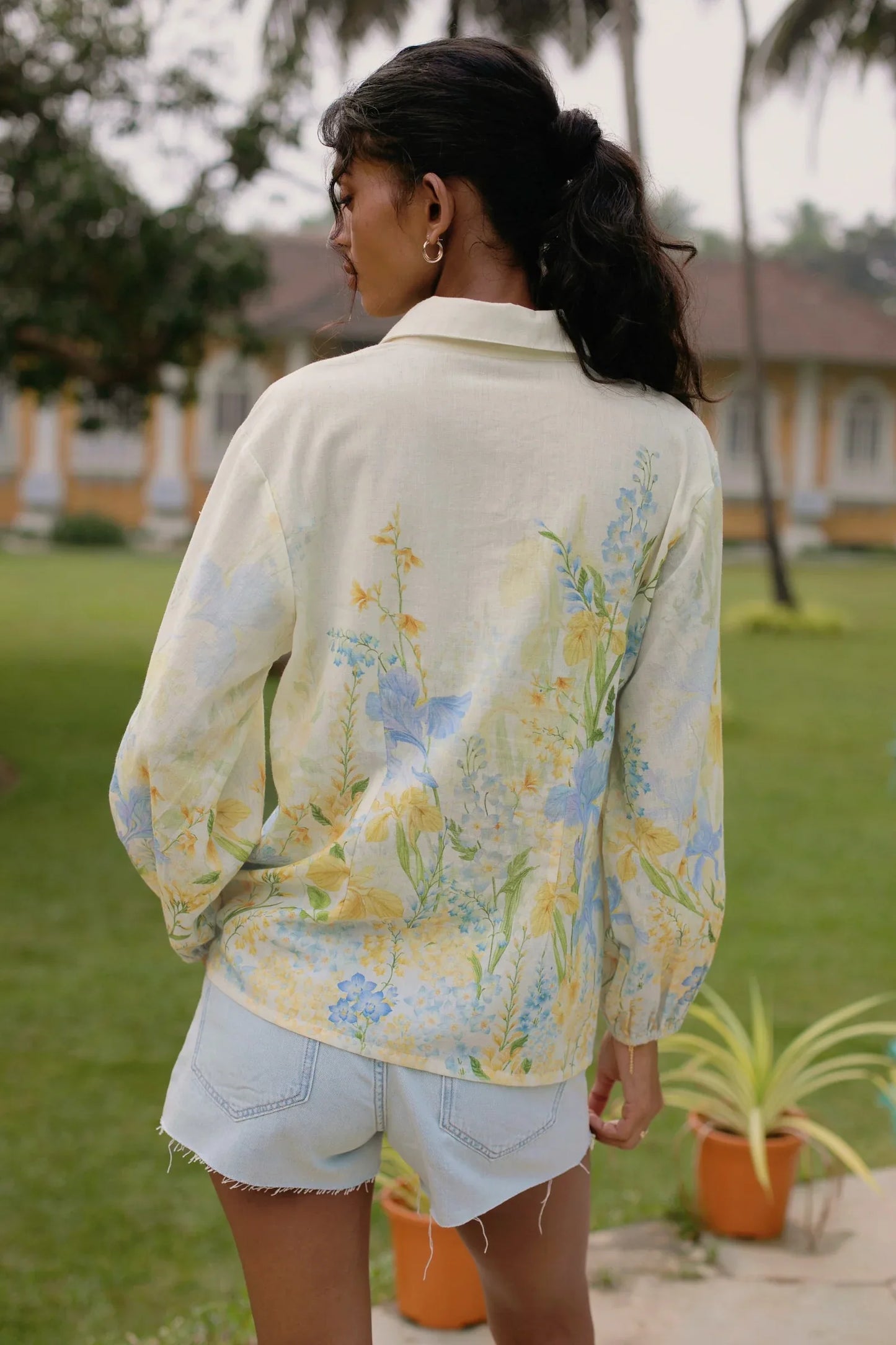 Back view of yellow floral cotton linen button-down shirt with relaxed fit — Amaya World slow fashion